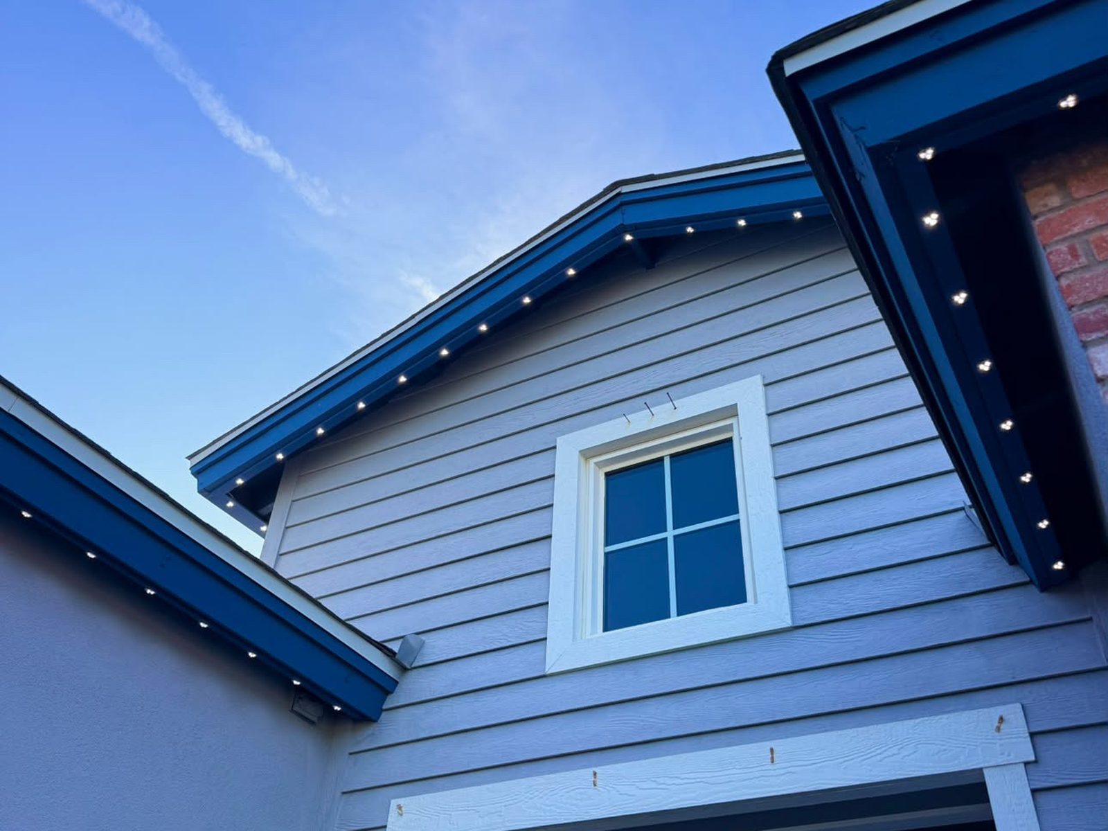 Track lights on blue fascia, hidden by day