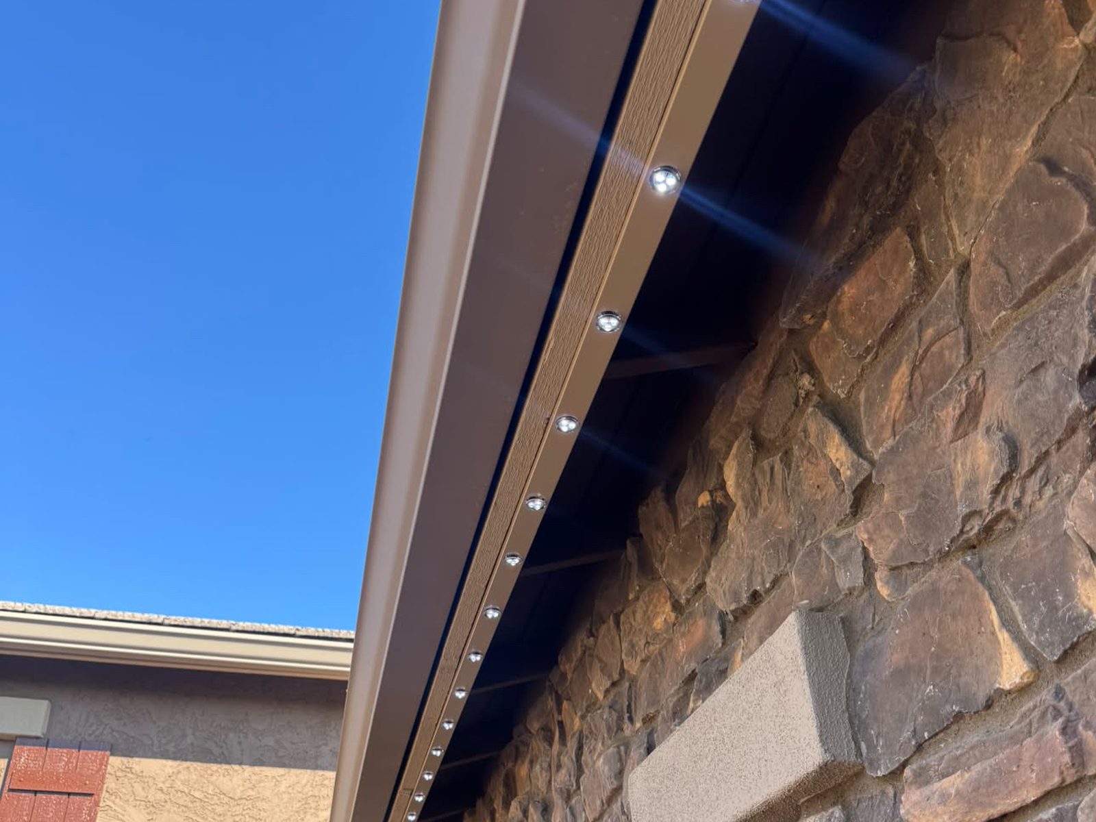Close-up of color-matched track on a stone home